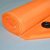 A rolled-up sheet of Longan Craft Multicolor 300D PU Coated Oxford Fabric is placed on a flat surface beside a Nikon lens cap for scale. This durable polyester material is ideal for making bags and backpacks.