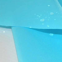 Close-up of Longan Craft’s Multicolor 300D Oxford Fabric by the yard, a PU-coated polyester material for bags and backpacks, showing water droplets beading on its surface to demonstrate its waterproof durability.
