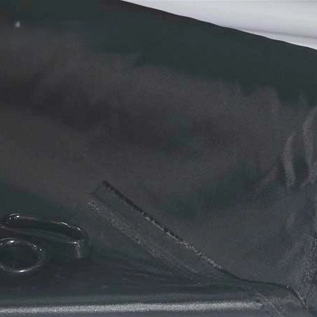 A close-up of Multicolor 300D Oxford Fabric by Longan Craft, partially folded, with a pair of black scissors resting on the PU coated polyester material—ideal for durable bags and backpacks.