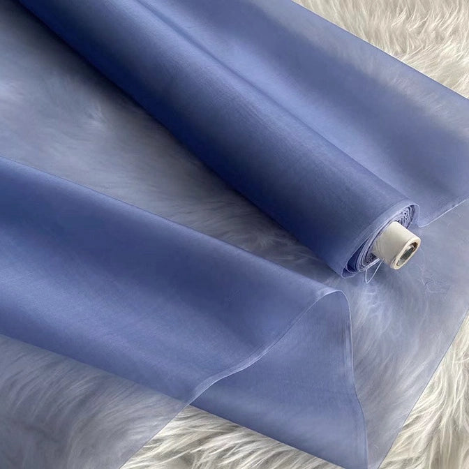 The Longan Craft Multicolor 8 Momme Organza Silk Fabric by the yard is pure Mulberry silk. This luxury, sheer material is smooth and delicate, ideal for elegant dresses and evening gowns.