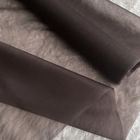 A close-up of Longan Craft's Multicolor 8 Momme Organza Silk Fabric by the yard, made from pure mulberry silk. The luxurious fabric is sheer, lightweight, and slightly translucent—ideal for elegant dresses.