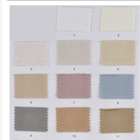 The Longan Craft Multicolor Cotton Bamboo Blend Lyocell Fabric swatch card displays 12 numbered wrinkle-free twill samples in a 3x4 grid, perfect for previewing DIY pants materials.
