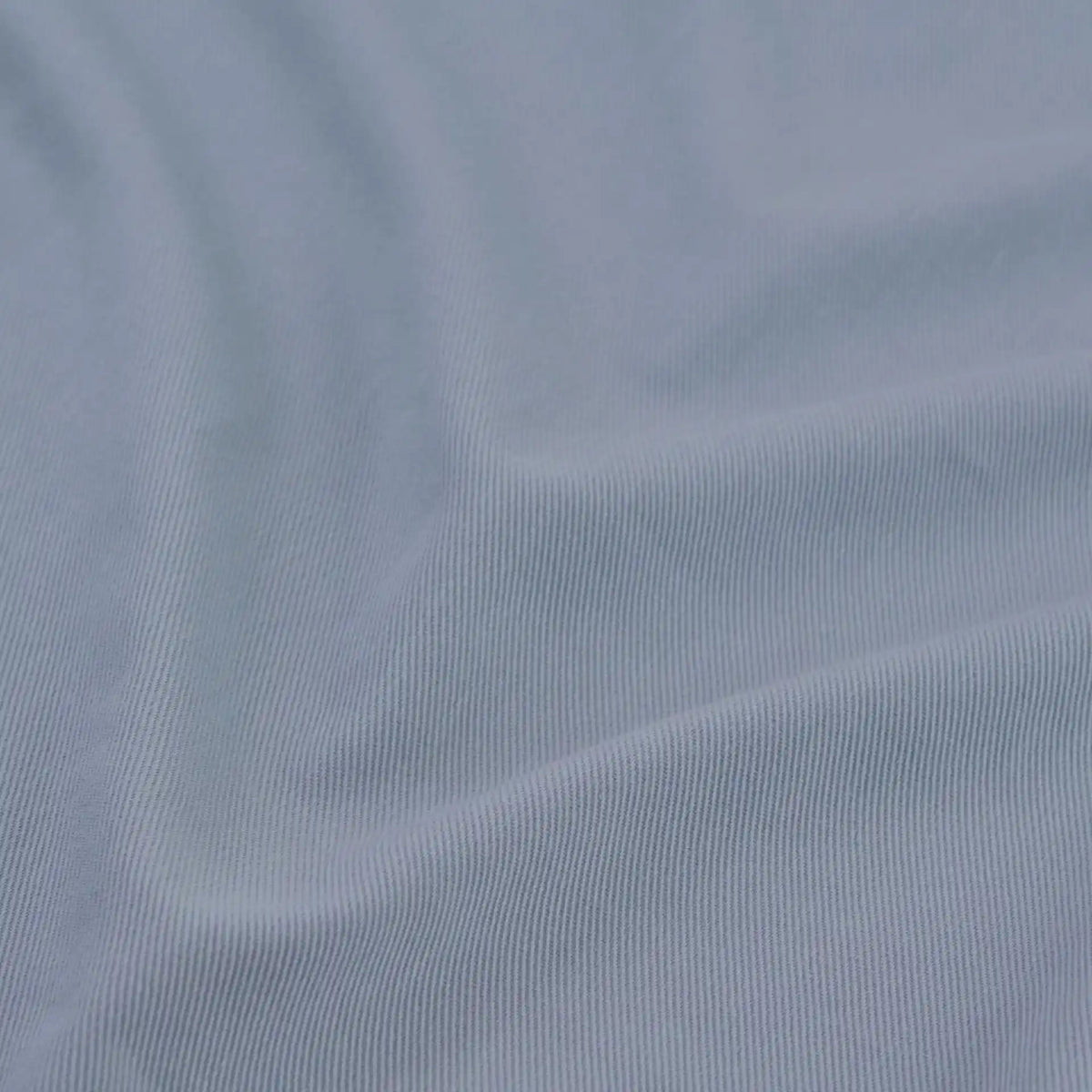 Close-up of Longan Craft's multicolor cotton bamboo blend lyocell fabric by the yard, a wrinkle-free twill material with a fine ribbed texture and soft folds—ideal for DIY pants and textile projects.