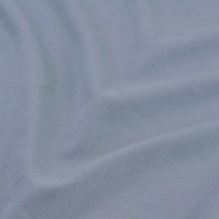 Close-up of Longan Craft's multicolor cotton bamboo blend lyocell fabric by the yard, a wrinkle-free twill material with a fine ribbed texture and soft folds—ideal for DIY pants and textile projects.