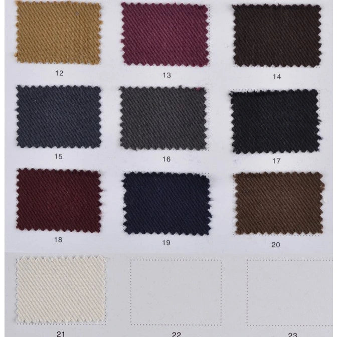 A Longan Craft swatch card features twelve Multicolor Cotton Bamboo Blend Lyocell fabric samples (numbered 12–21); the last row includes an off-white sample of this wrinkle-free twill material and two blank spaces labeled 22 and 23.