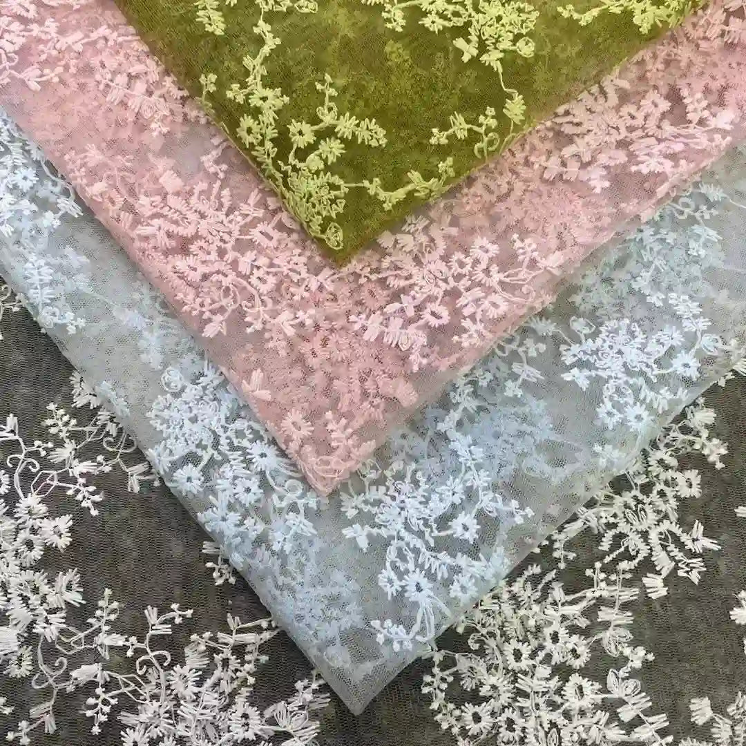 Four pieces of Longan Craft Multicolor Embroidered Floral Tulle Fabric feature pastel green, pink, and light blue shades with intricate cotton thread embroidery—perfect wedding lace material for adding elegance to any project.