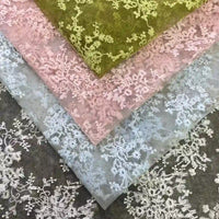 Four pieces of Longan Craft Multicolor Embroidered Floral Tulle Fabric feature pastel green, pink, and light blue shades with intricate cotton thread embroidery—perfect wedding lace material for adding elegance to any project.