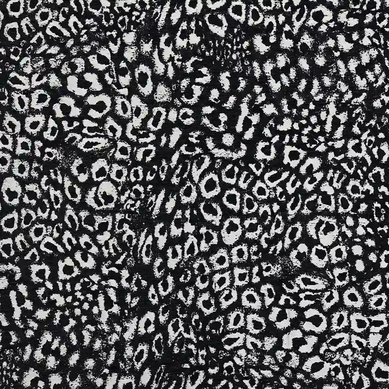 Multicolor Leopard Chenille Fabric By The Yard in a black and white leopard jacquard pattern with a textured polyester chenille weave.