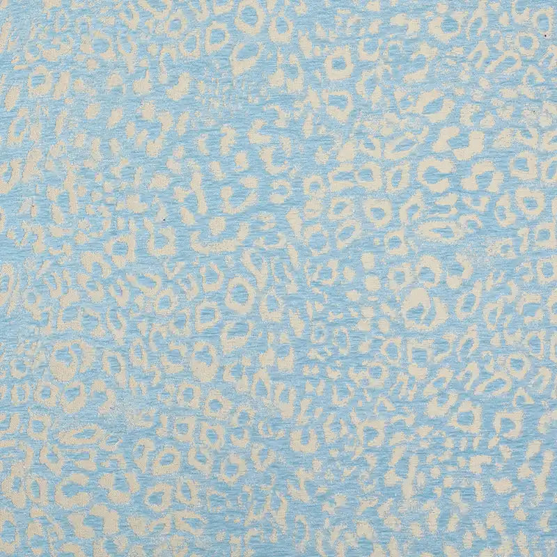 Multicolor Leopard Chenille Fabric By The Yard in light blue and cream with a textured jacquard pattern.