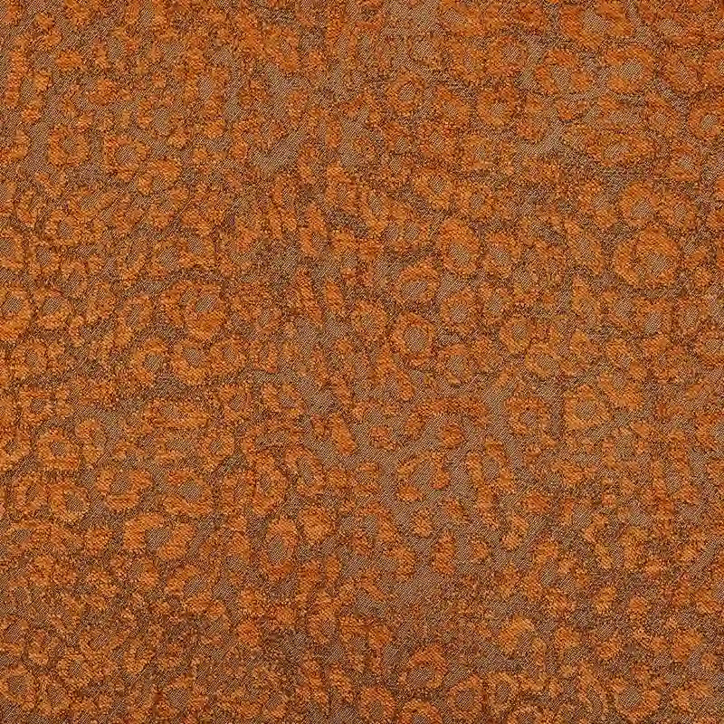 Multicolor Leopard Chenille Fabric By The Yard featuring a textured, orange and brown leopard jacquard pattern.