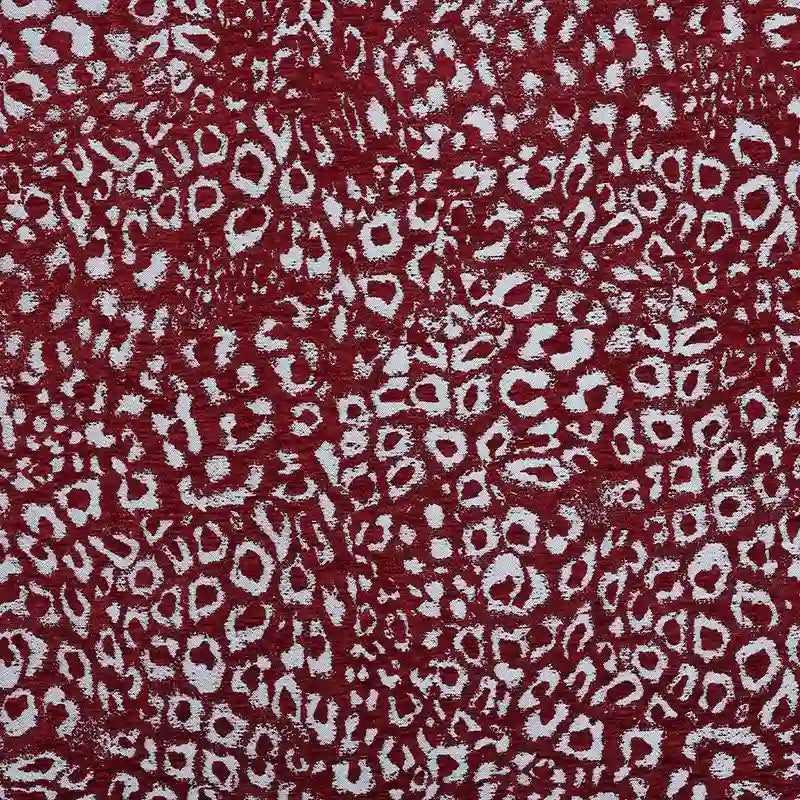 Multicolor Leopard Chenille Fabric By The Yard in a textured red and white leopard jacquard pattern.