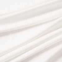 Close-up of Longan Craft’s Multicolor Polyester Jersey Fabric by the yard, showing smooth, stretchable elastane jersey with soft folds. The breathable texture creates gentle, shadowed lines—perfect for jersey dress projects.
