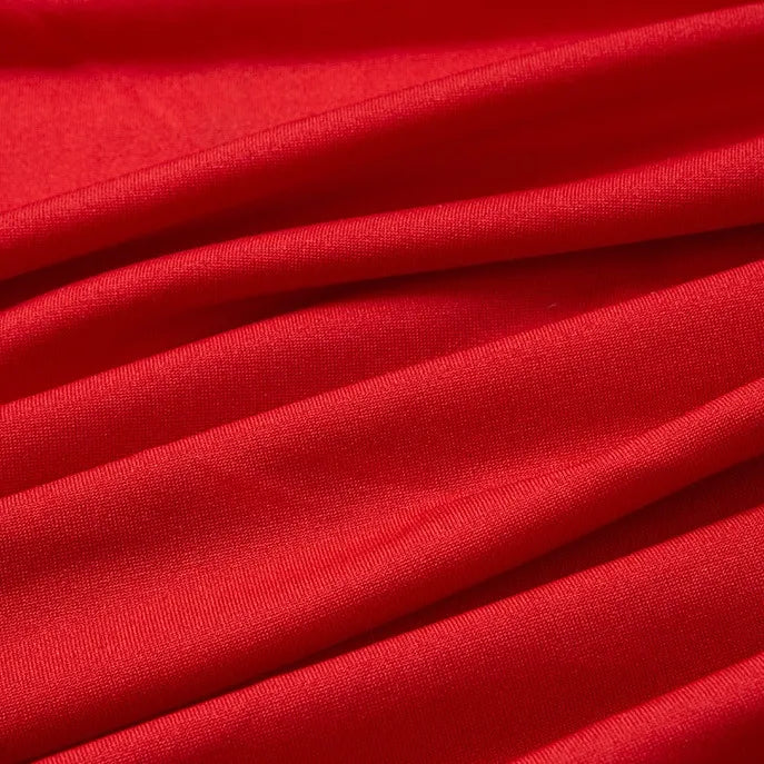 Close-up of Longan Craft Multicolor Polyester Elastane Jersey Fabric shows smooth, slightly shiny, wrinkle-resistant texture with gentle folds and soft shadows—perfect stretchable jersey fabric by the yard for dresses.