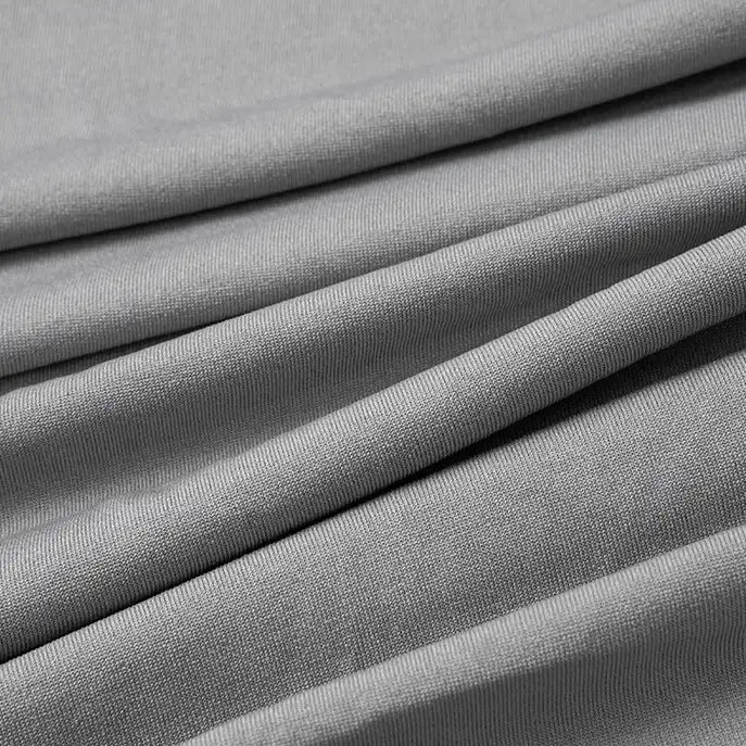 Close-up of Longan Craft Multicolor Polyester Jersey Fabric by the Yard, a stretchable elastane jersey dress fabric in light gray. The smooth, breathable material features soft folds and subtle parallel diagonal lines for gentle draping.