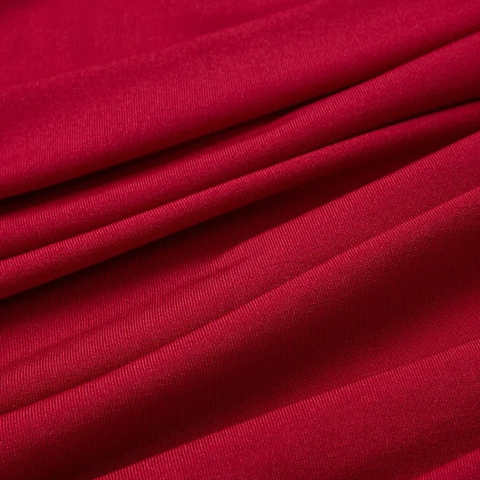 A close-up of smooth, folded Multicolor Polyester Jersey Fabric by Longan Craft highlights its fine texture and soft, flowing look—ideal as stretchable Elastane jersey dress fabric by the yard.