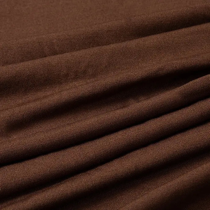 Close-up of Multicolor Polyester Jersey Fabric by Longan Craft, showing its smooth, soft, stretchable elastane material with visible grain and neat stitching—ideal for dresses and available by the yard.