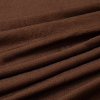 Close-up of Multicolor Polyester Jersey Fabric by Longan Craft, showing its smooth, soft, stretchable elastane material with visible grain and neat stitching—ideal for dresses and available by the yard.