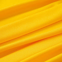 Bright multicolor polyester jersey fabric by the yard from Longan Craft, featuring stretchable elastane. The smooth material has soft, diagonal folds for a textured effect and reflects light to highlight the contours—ideal for dresses.