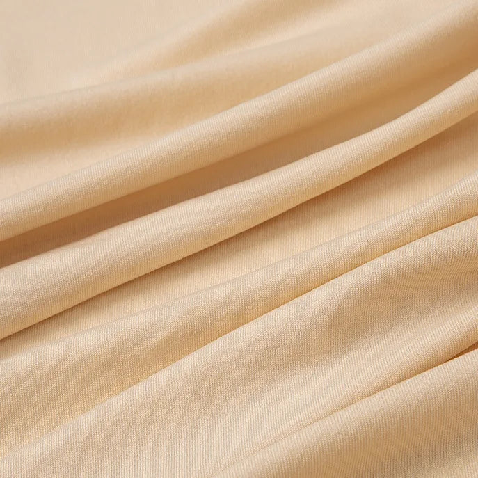 Close-up of Longan Craft Multicolor Polyester Jersey Fabric by the Yard, featuring stretchable elastane with a soft, smooth texture and gentle diagonal folds. Ideal jersey dress fabric with wrinkle resistance.