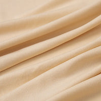 Close-up of Longan Craft Multicolor Polyester Jersey Fabric by the Yard, featuring stretchable elastane with a soft, smooth texture and gentle diagonal folds. Ideal jersey dress fabric with wrinkle resistance.