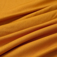 Close-up of Longan Craft Multicolor Polyester Jersey Fabric By The Yard shows its stretchable elastane weave, soft texture, breathable quality, and smooth folds with visible diagonal lines and shadows.