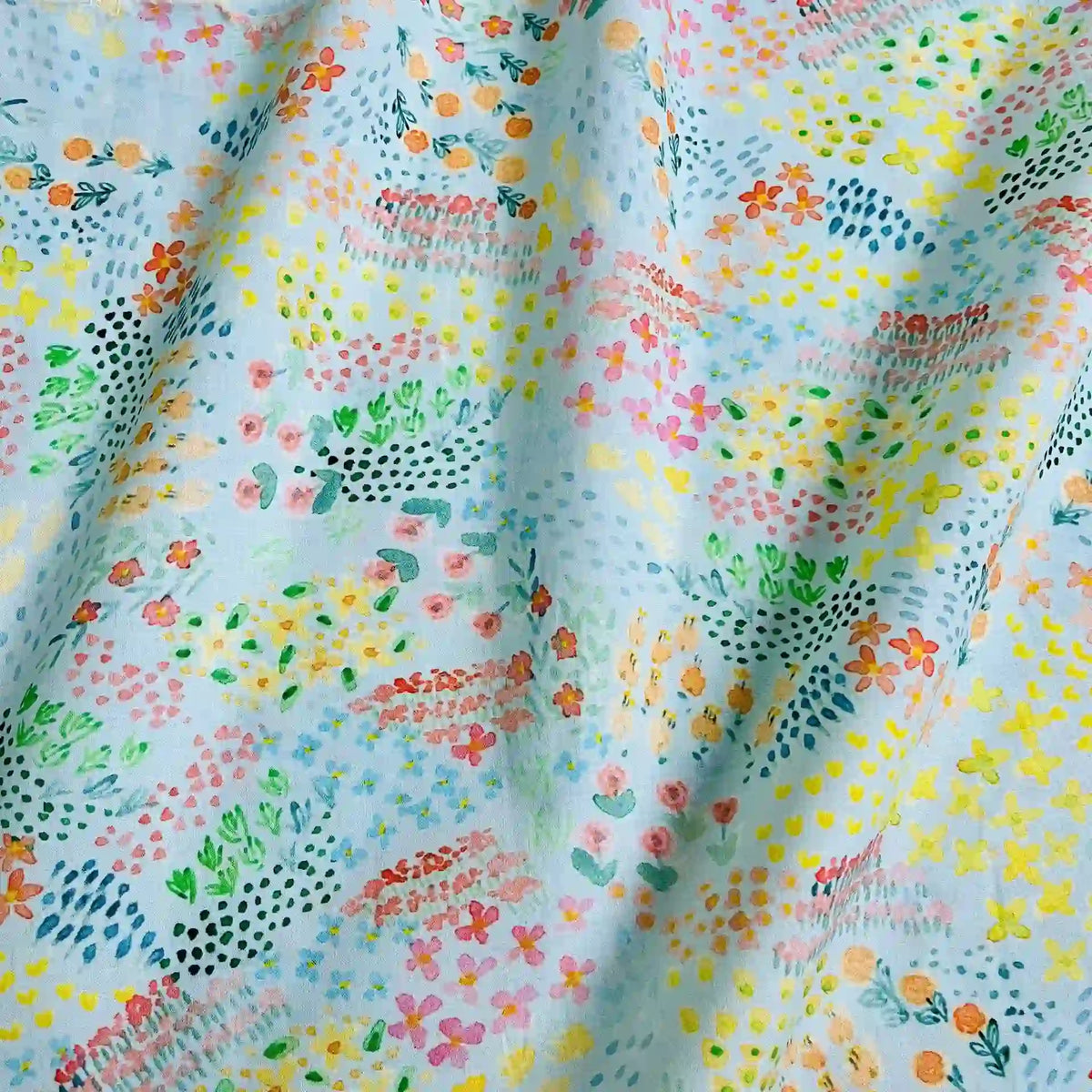 Longan Craft Multicolor Printed Lawn Fabric By The Yard features an abstract floral cotton design in pink, yellow, green, orange, and blue—ideal for dressmaking with its soft lawn material and gentle drape.