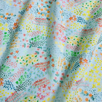 Longan Craft Multicolor Printed Lawn Fabric By The Yard features an abstract floral cotton design in pink, yellow, green, orange, and blue—ideal for dressmaking with its soft lawn material and gentle drape.