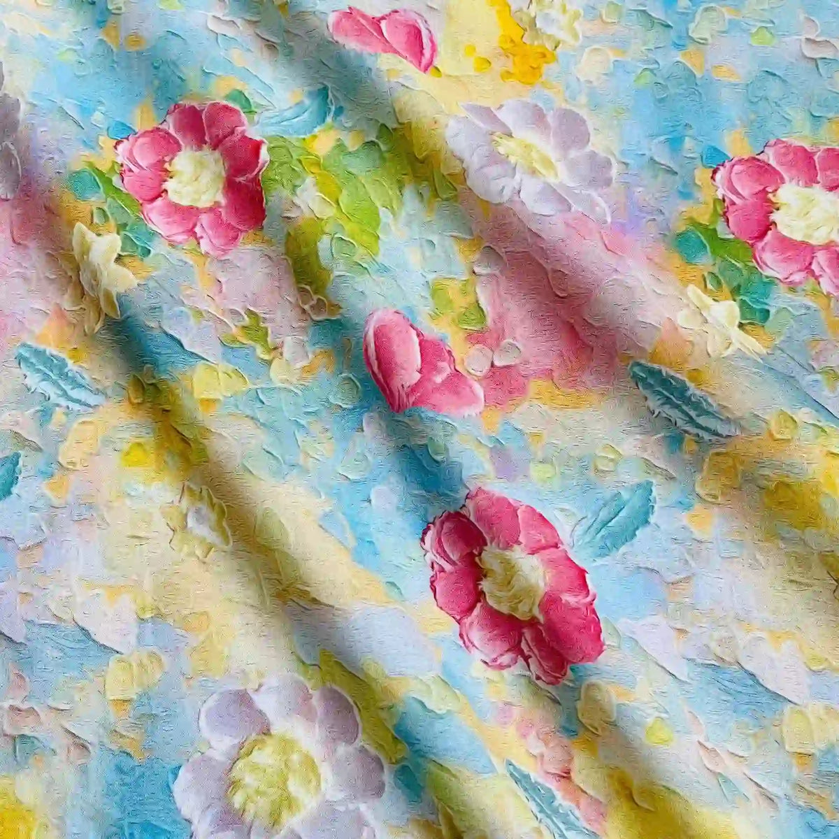 Longan Craft’s Multicolor Printed Lawn Fabric By The Yard features large red, pink, and white floral patterns with green leaves on a pastel blue, yellow, and peach background—soft cotton lawn material for gentle drape and beautiful folds.