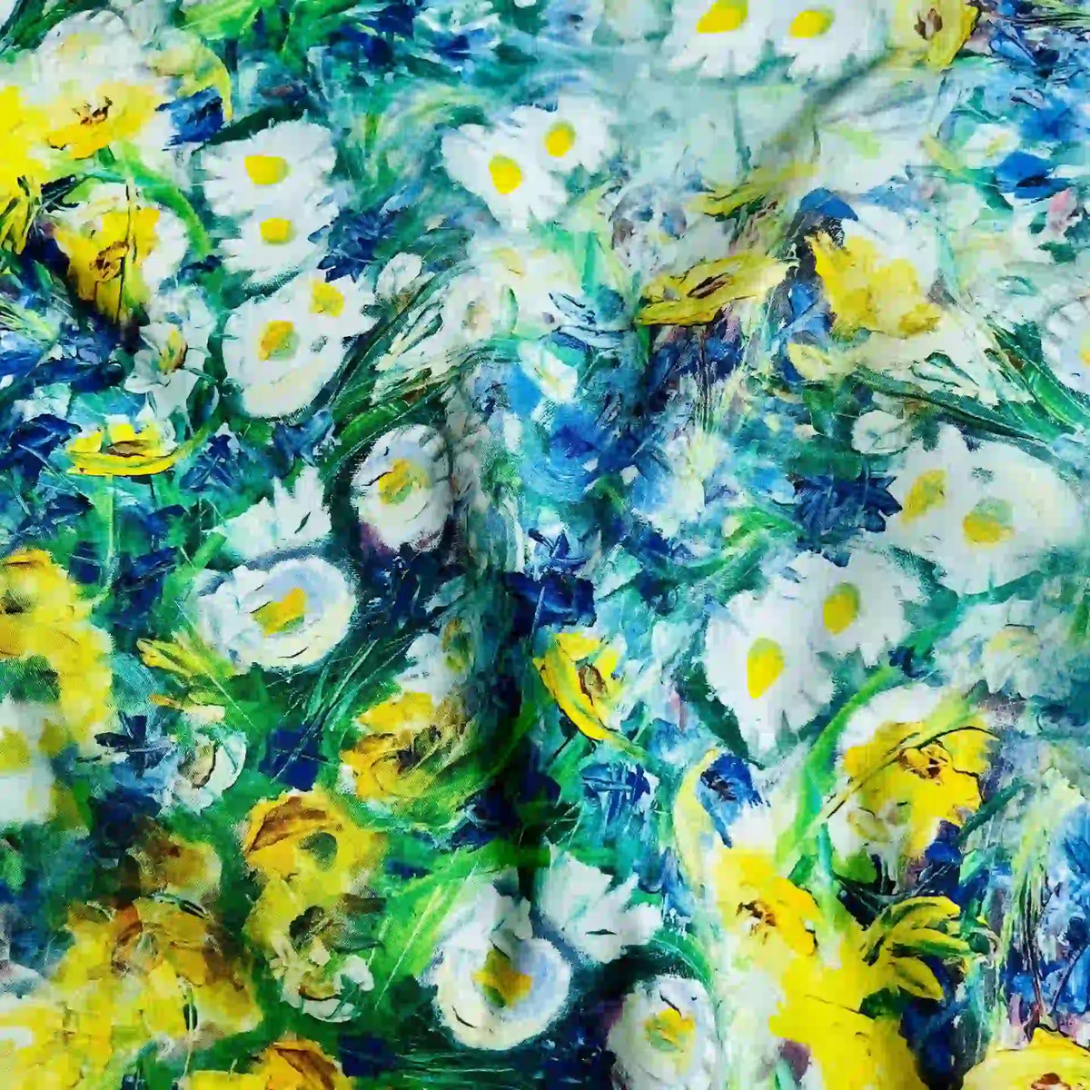 The Multicolor Printed Lawn Fabric by Longan Craft features a soft cotton lawn material with vibrant white daisies, yellow flowers, and green leaves on a vivid blue and green background—perfect for lively, floral-inspired projects.