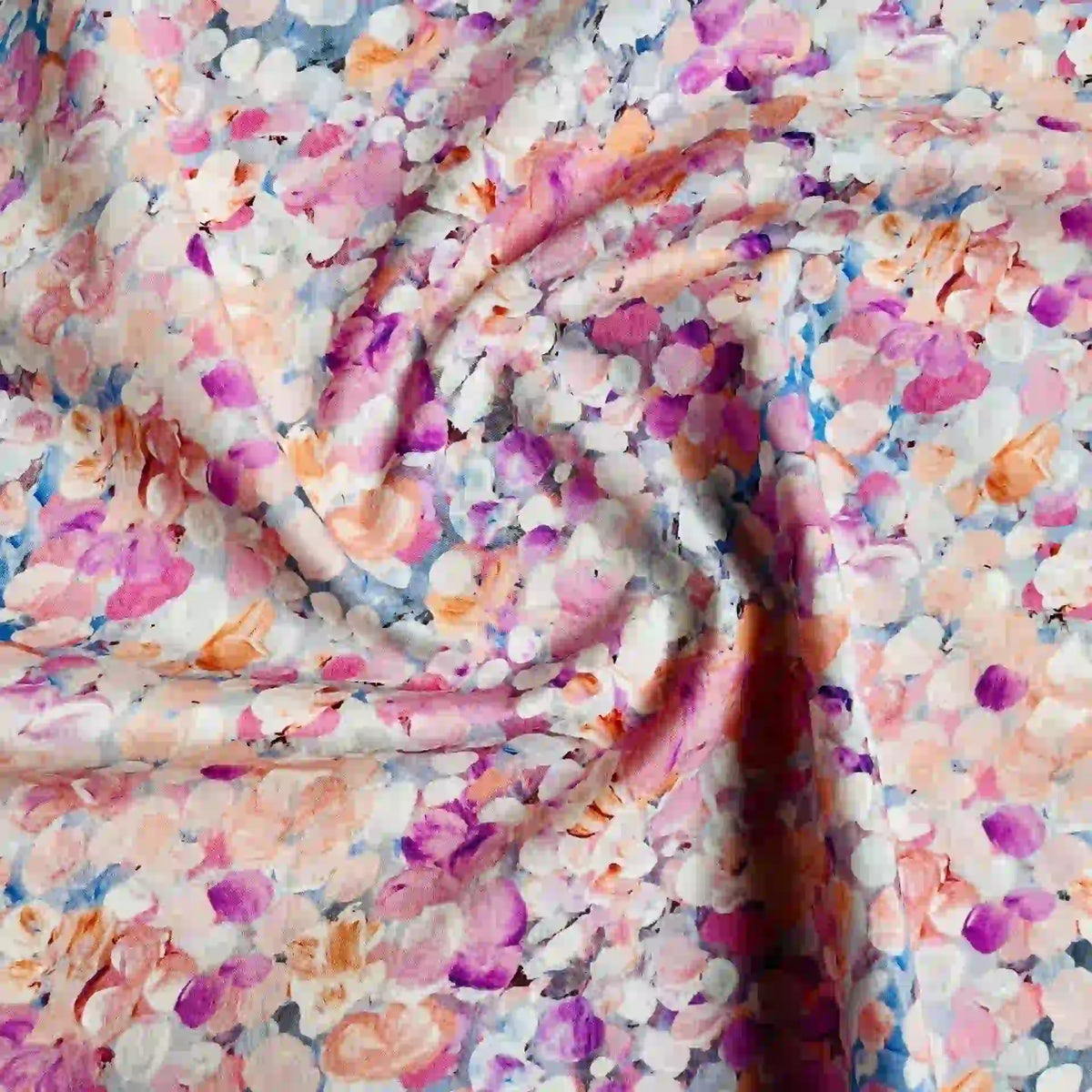 Longan Craft's Multicolor Printed Lawn Fabric by the yard is a soft cotton lawn material featuring a vibrant abstract floral pattern in pink, purple, orange, and white for a textured look.