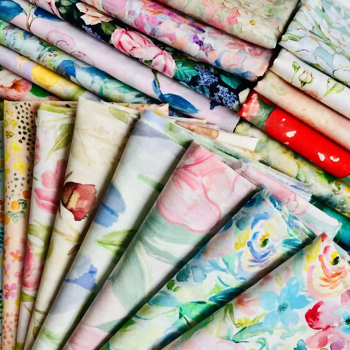 Rows of Multicolor Printed Lawn Fabric by the Yard from Longan Craft showcase soft, floral cotton lawn cloths in watercolor-inspired pastel and vibrant hues.
