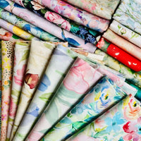 Rows of Multicolor Printed Lawn Fabric by the Yard from Longan Craft showcase soft, floral cotton lawn cloths in watercolor-inspired pastel and vibrant hues.