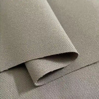 Close-up of Longan Craft’s Multicolor Rayon Gabardine Fabric by the yard, a stretch viscose twill gabardine textile with a fine diagonal ribbed texture, featuring a neatly folded section atop a flat piece—ideal for custom uniforms.