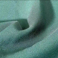 A close-up of Longan Craft's Multicolor Rayon Gabardine Fabric By The Yard shows fine diagonal ridges and a smooth, slightly wavy texture—this stretch viscose twill gabardine is versatile for custom uniforms.