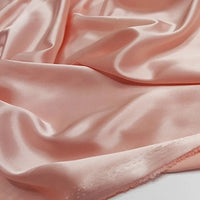 A close-up of Longan Craft Multicolor Satin Fabric by the Yard shows its silky polyester surface and soft folds, highlighting a luxurious appearance—perfect for apparel and textile projects.