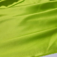 A close-up of Longan Craft's Multicolor Satin Fabric by the Yard shows silky polyester with gentle folds and a shiny finish—ideal for apparel and crafts.