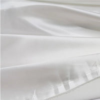 Close-up of Multicolor Satin Fabric By The Yard by Longan Craft—silky polyester satin with a subtle sheen and gentle folds, ideal for apparel and creative projects.