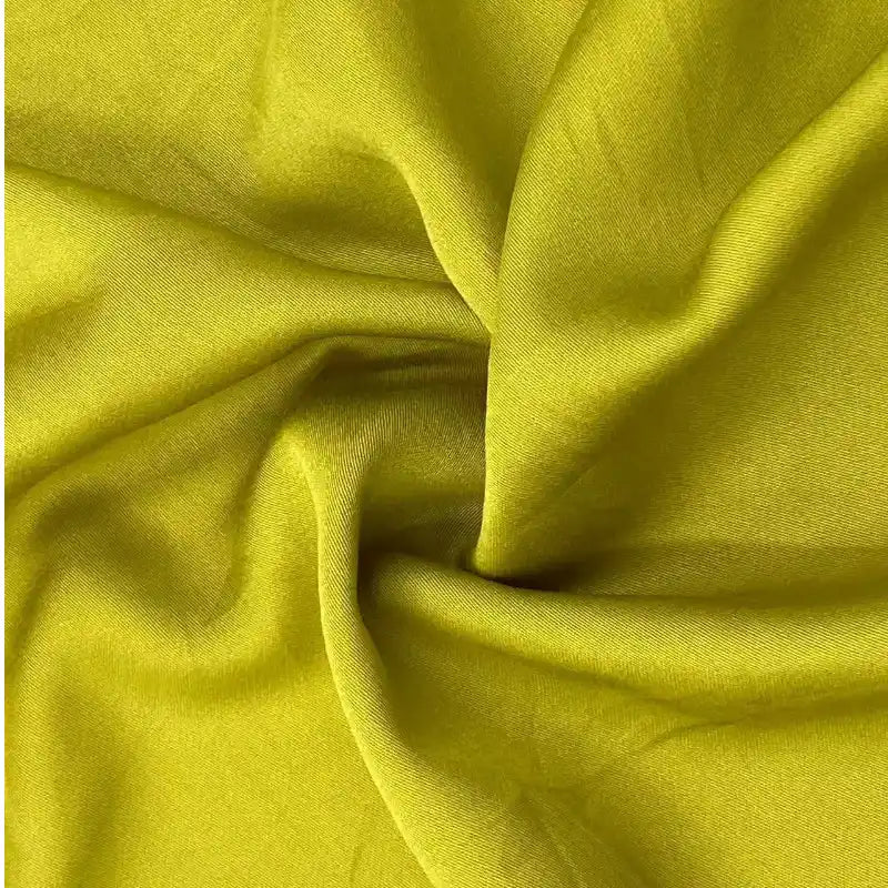 A close-up of Longan Craft’s Multicolor Satin Viscose Fabric by the Yard shows its smooth, soft texture and gentle folds—100% viscose cellulose, ideal for stylish evening gowns.