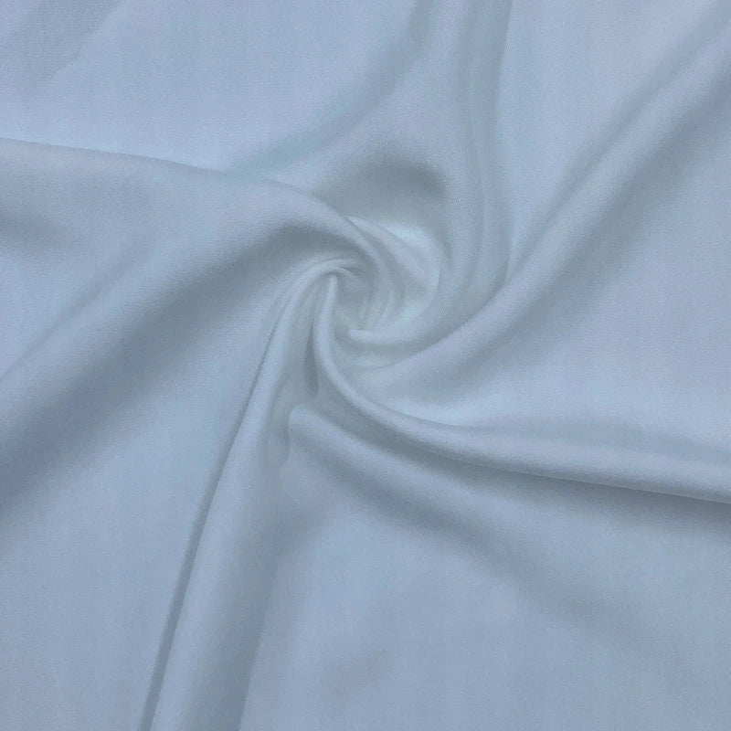 A close-up of Longan Craft’s Multicolor Satin Viscose Fabric by the yard, made from 100% viscose cellulose, with a soft, smooth texture and elegant folds—ideal for stylish evening gowns.