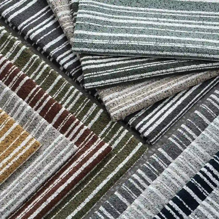 Longan Craft’s Multicolor Striped Chenille Fabric by the Yard features thick poly chenille in green, brown, gray, yellow, and blue stripes arranged in an overlapping flat lay for a vibrant display.