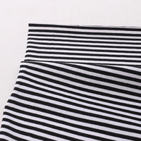 A close-up of Longan Craft Multicolor Striped Cotton Jersey Fabric By The Yard shows horizontal stripes on stretch elastane jersey, with lower stripes appearing diagonal from fabric folds.
