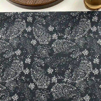 Longan Craft's Paisley Printed Voile Fabric By The Yard is a pure cotton material in dark blue with a white paisley and floral pattern, perfect for shirts. A woven tray and cup appear at the edge of the image.