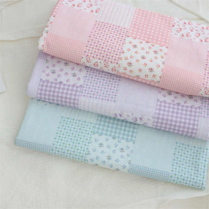 Three folded Longan Craft Patchwork Plaid Print Poplin fabrics in pastel pink, lavender, and light blue show checks, stripes, polka dots, and florals in a neat grid pattern on a light surface.