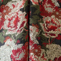 A close-up of Longan Craft’s Peony Embossed Metallic Brocade Fabric by the yard, featuring luxurious golden black floral jacquard texture with ornate peony patterns—ideal for formal dresses.