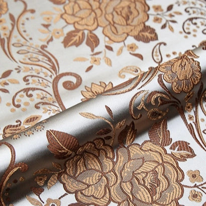 A close-up of Longan Craft's Peony Jacquard Brocade Fabric by the yard shows its colorful Chinese floral pattern, elegant brown and gold tones, and smooth, luxurious texture—perfect for formal dresses.
