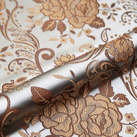 A close-up of Longan Craft's Peony Jacquard Brocade Fabric by the yard shows its colorful Chinese floral pattern, elegant brown and gold tones, and smooth, luxurious texture—perfect for formal dresses.