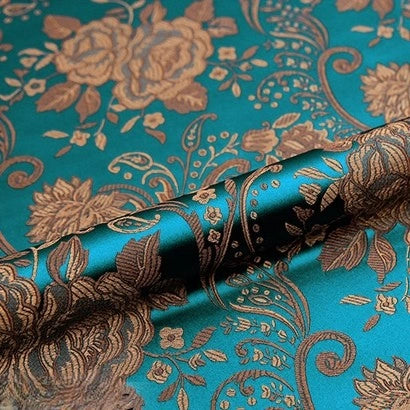 A close-up of Longan Craft’s Peony Jacquard Brocade Fabric By The Yard, a colorful Chinese floral brocade with intricate gold flowers and leaves—ideal material for creating elegant, luxurious formal dresses.
