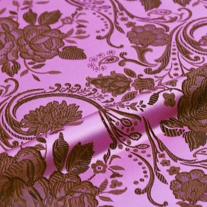 A close-up of Longan Craft’s Peony Jacquard Brocade Fabric by the yard showcases colorful Chinese floral patterns with roses and swirling vines—ideal brocade material for formal dresses, adding delicate texture and elegance.