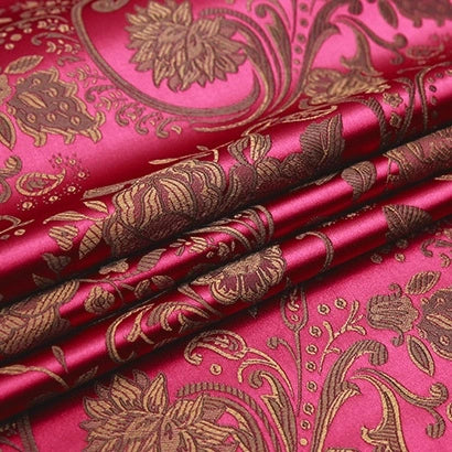 Longan Craft’s Peony Jacquard Brocade Fabric by the yard features a colorful Chinese floral design with ornate gold detailing—perfect for formal dresses. Its glossy texture highlights elegant, intricate brocade patterns.