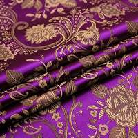 A close-up of folded Peony Jacquard Brocade Fabric By The Yard from Longan Craft, showcasing its colorful Chinese floral brocade and detailed gold roses—ideal material for crafting elegant formal or bridal dresses.